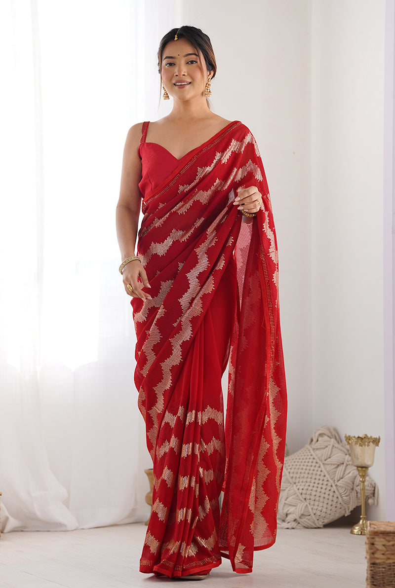 Red georgette saree featuring intricate sequins work