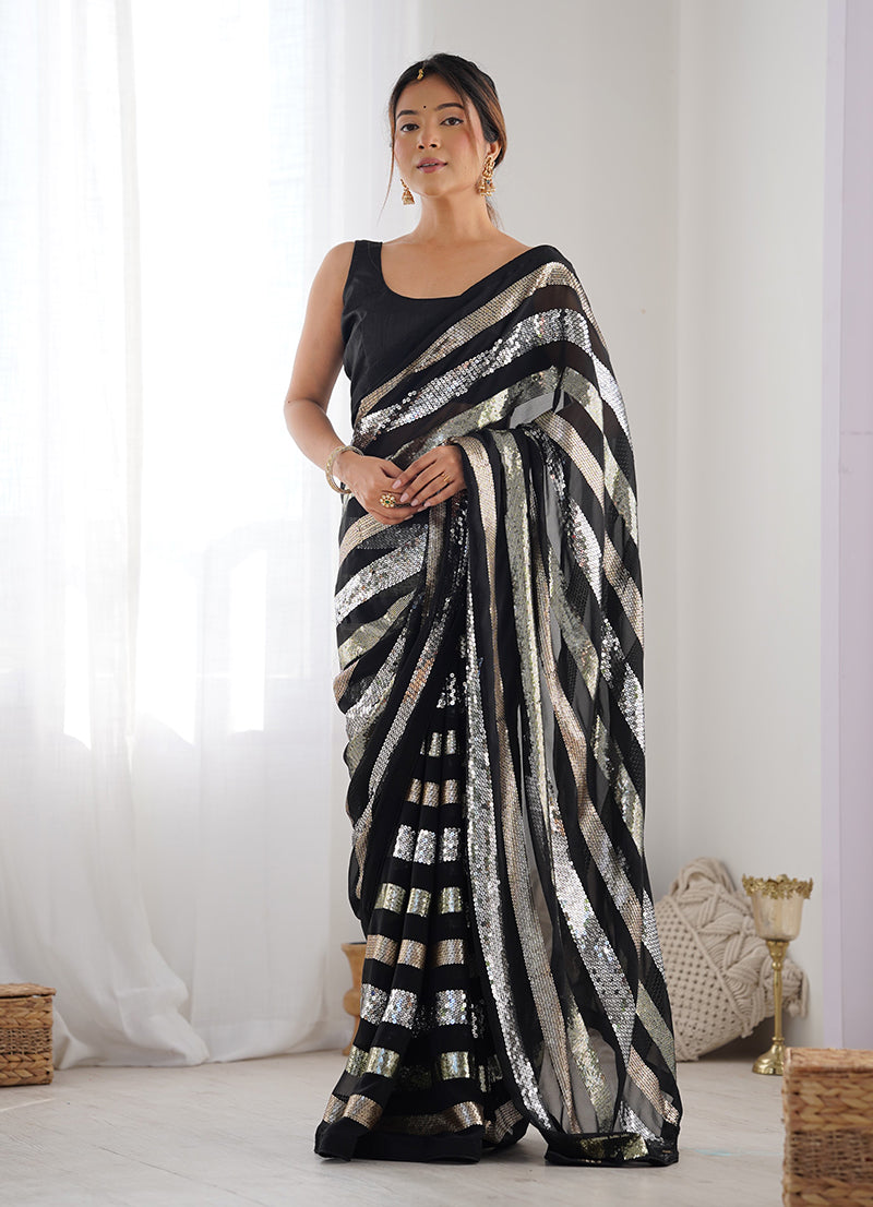 Elegant black georgette saree featuring detailed sequin work for festive parties.