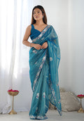 Teal blue net saree with detailed embroidery and sequin work