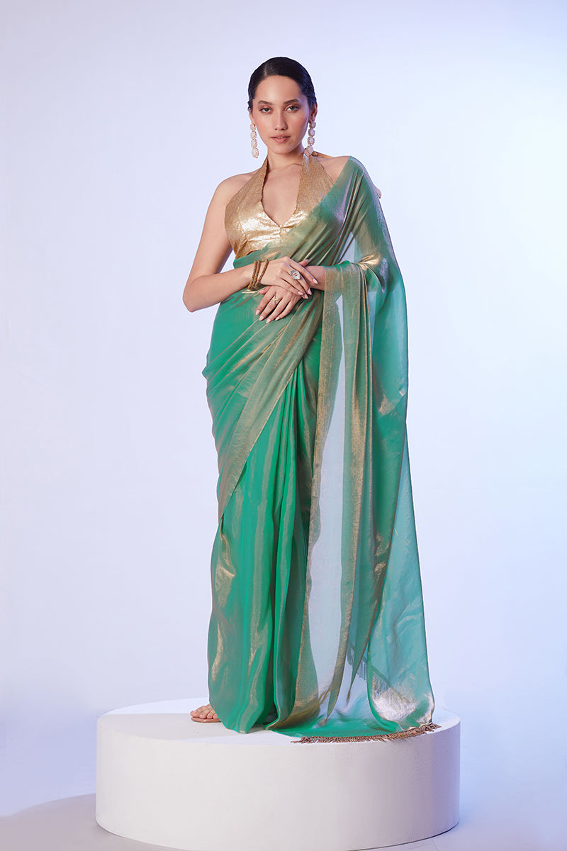 Sea green satin organza saree with lace trim and gold art silk blouse