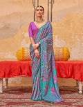 A beautiful turquoise silk blend saree with modern ethnic prints.