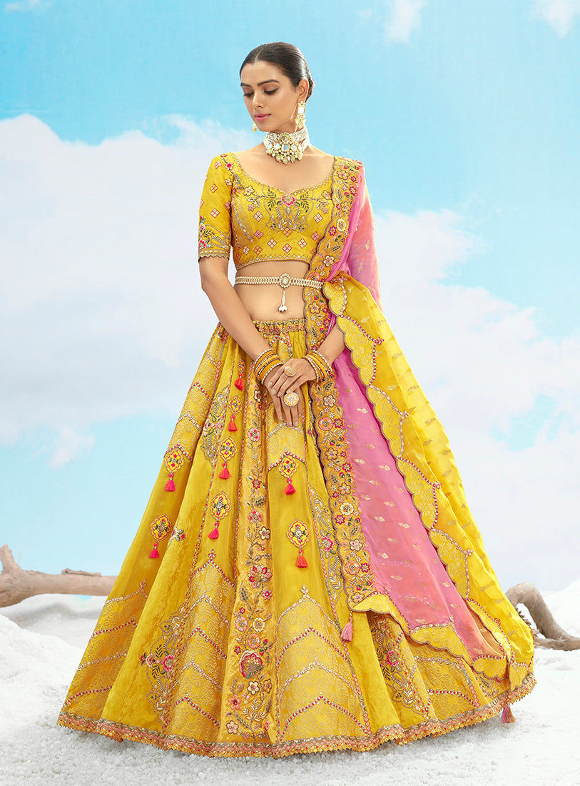 Vibrant yellow silk lehenga choli with designer sequins embroidery