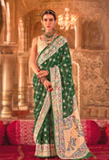 Stunning green silk blend saree featuring traditional Bandhej prints for festive wear.