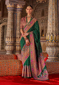 Dark green embellished and printed silk blend saree