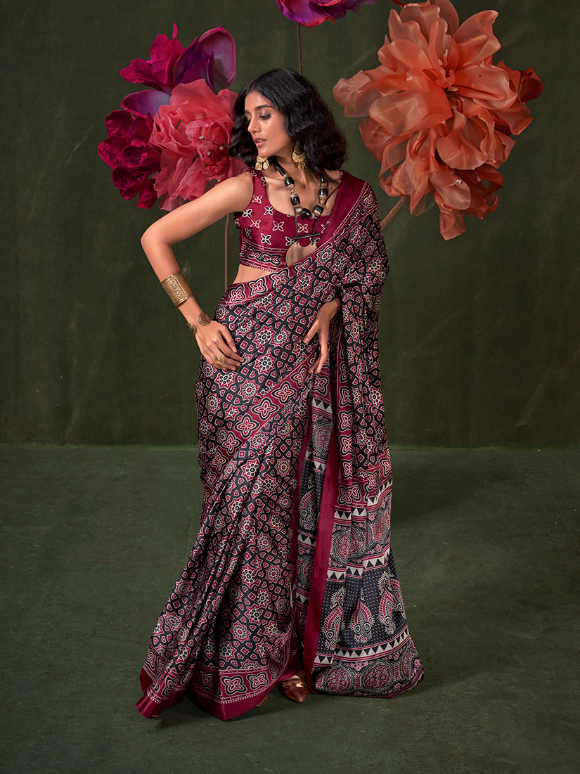 Sophisticated black satin crepe printed saree with a smooth, contemporary drape