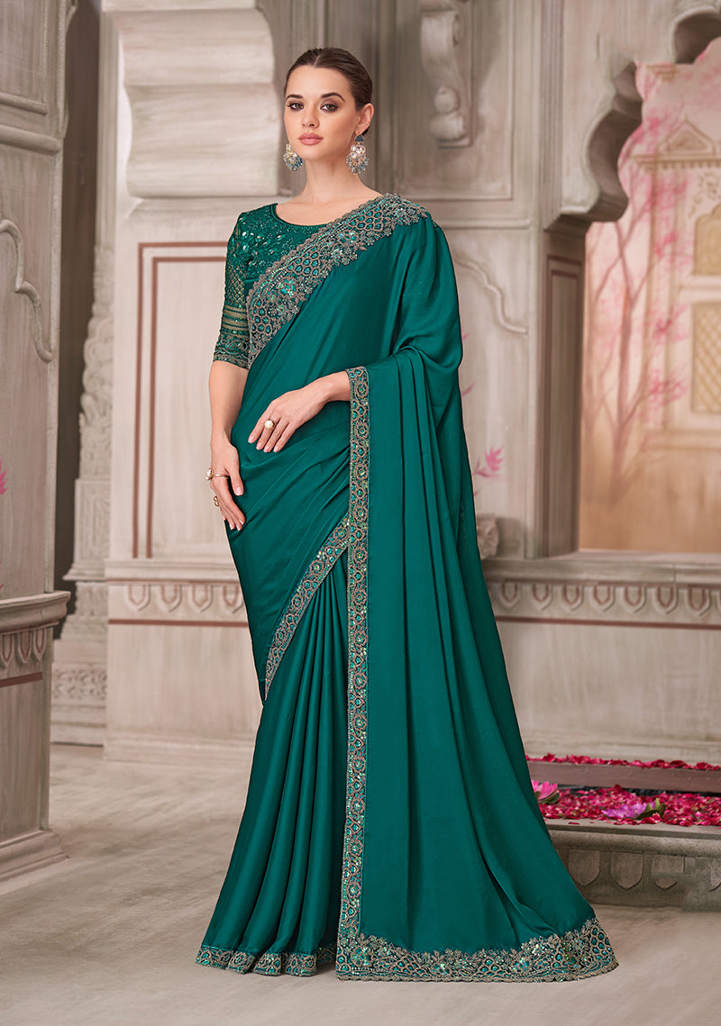 Teal green satin silk saree featuring detailed embroidery and sequin work