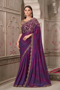 Deep purple satin georgette saree with intricate gold embroidery and stone embellishments
