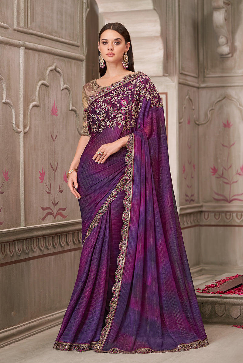 Deep purple satin georgette saree with intricate gold embroidery and stone embellishments