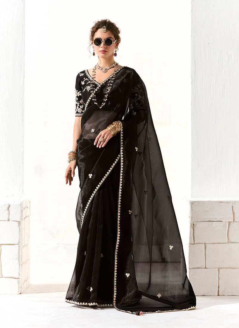 Black tissue saree featuring elegant embroidery and sequin work for a Sangeet event