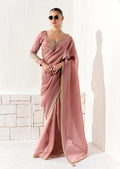 Dusty rose tissue organza saree featuring ethnic sequins and detailed embroidery.