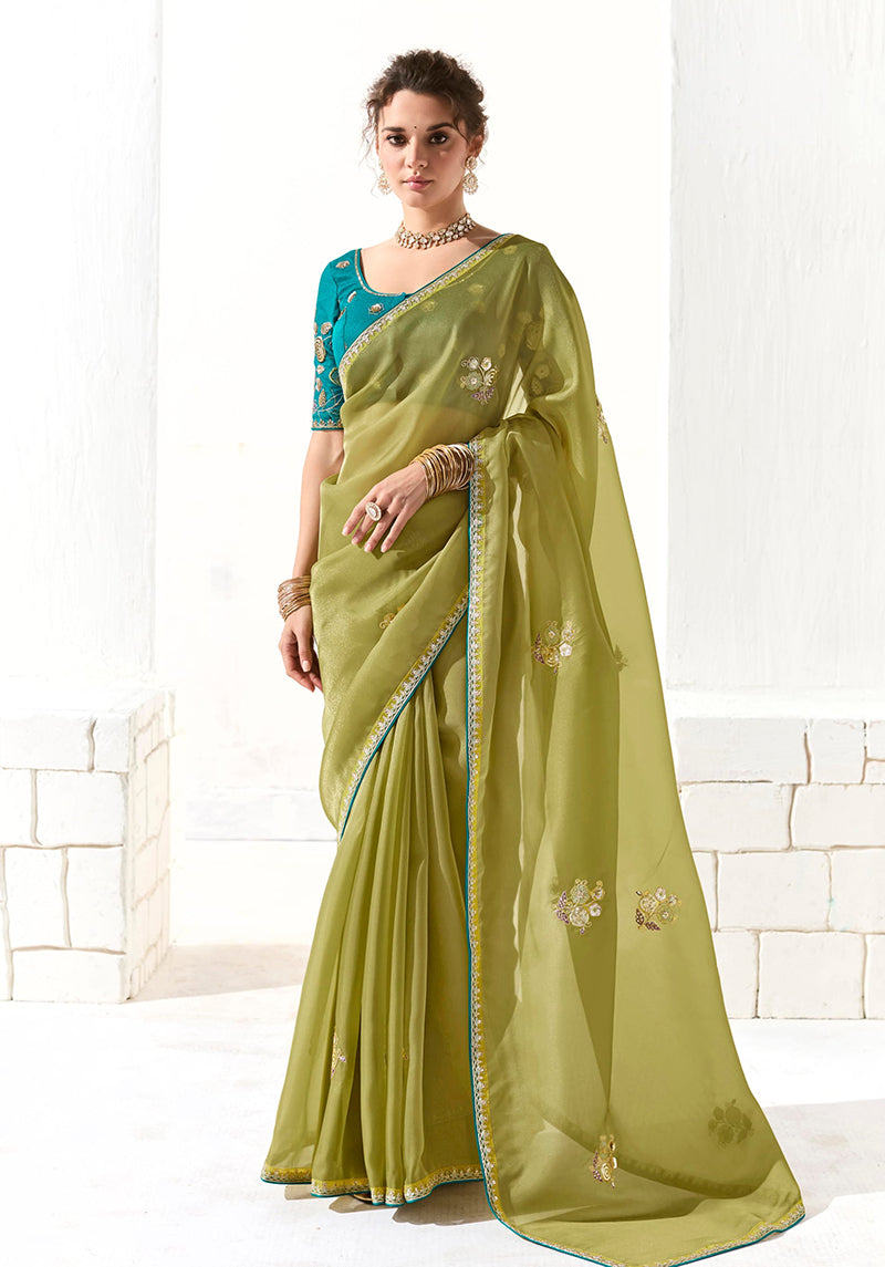 Monjolika Fashion Olive Green Tissue Organza Saree with detailed embroidery and zari border