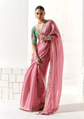 Pink tissue designer saree featuring an intricate embroidered border
