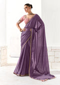 Lilac tissue saree with intricate sequin embroidery and a soft organza drape.
