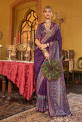 Dark purple silk blend saree featuring detailed paisley prints.