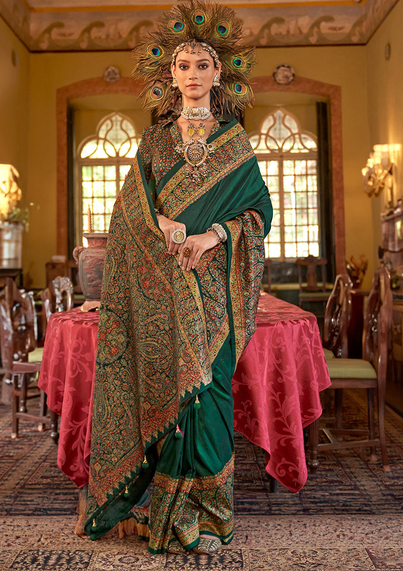 Dark green silk blend saree with intricate paisley prints for a sophisticated look.