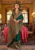 Dark green silk blend saree with intricate paisley prints for a sophisticated look.