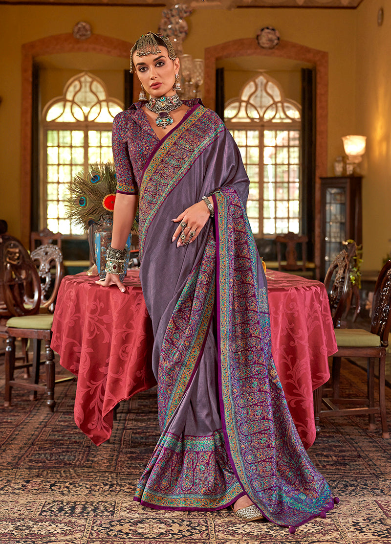 A beautiful lilac silk blend saree featuring detailed paisley prints and a contemporary drape.
