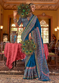 Blue silk blend saree featuring intricate paisley print patterns