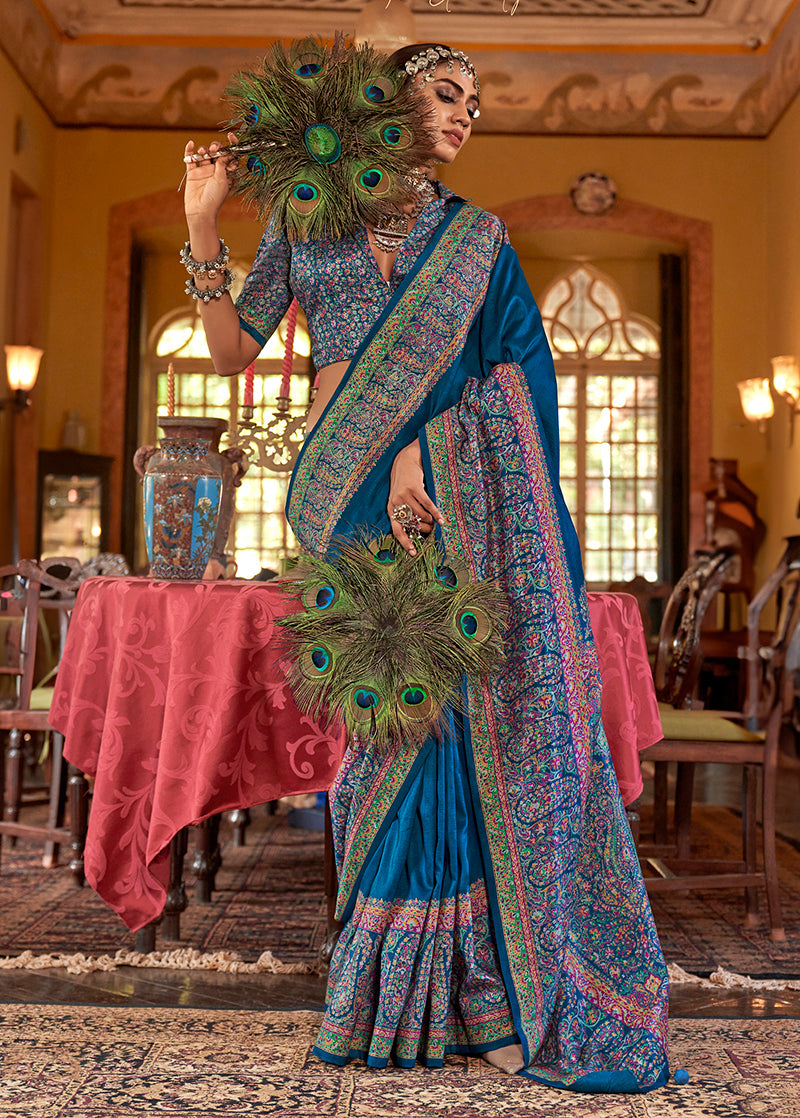 Blue silk blend saree featuring intricate paisley print patterns