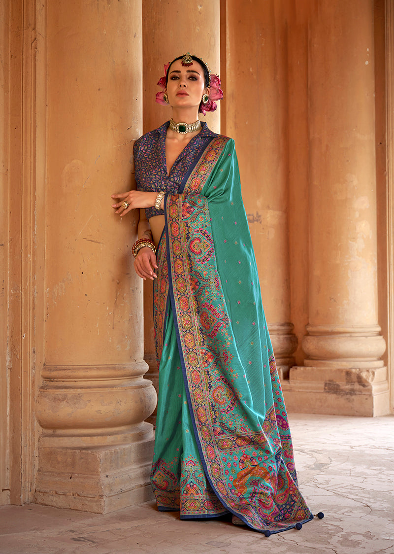 Turquoise silk blend saree with elegant print work.
