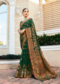 Dark green poly viscose georgette Banarasi saree with intricate Meenakari jaal patterns.