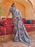 Monjolika Fashion light lavender and grey floral print silk blend saree with woven border