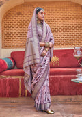 Light purple silk blend saree with floral prints and a tasseled pallu