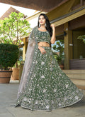 Green tissue lehenga choli with heavy resham, zari, and stone embroidery work