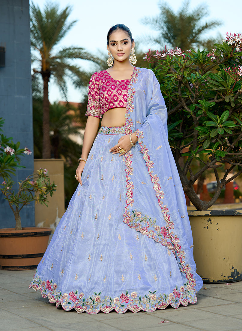 Sky blue viscose lehenga paired with rani pink jacquard choli and embroidery