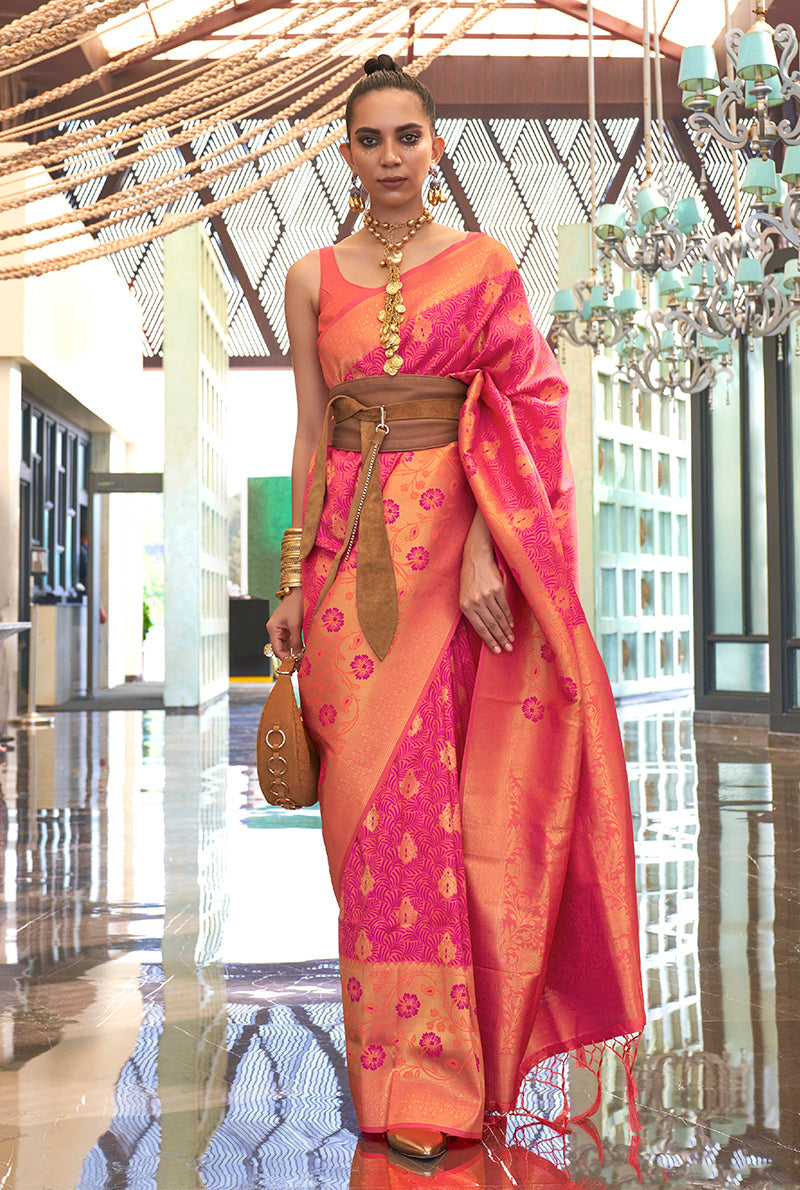 Peach and pink handloom silk blend saree with intricate weaving patterns