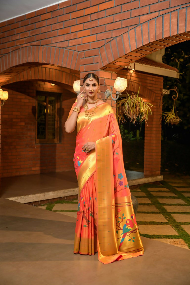 Vibrant orange Paithani silk saree with Zari woven patterns and matching blouse