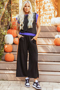 A stylish colorblock two-piece loungewear set featuring a crew neck cap sleeve top and flowing wide-leg pants.