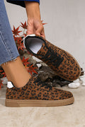 Womens leopard print lace-up sneakers with tan soles and white heel tabs