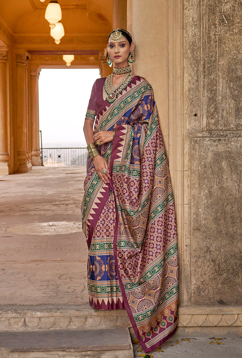 Multicolour silk blend saree with geometric block print and royal purple, blue, and emerald accents.