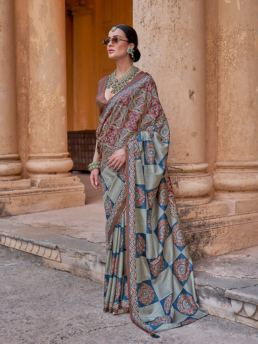 Multicolour paisley print silk blend saree with brown and blue accents, traditionally styled.