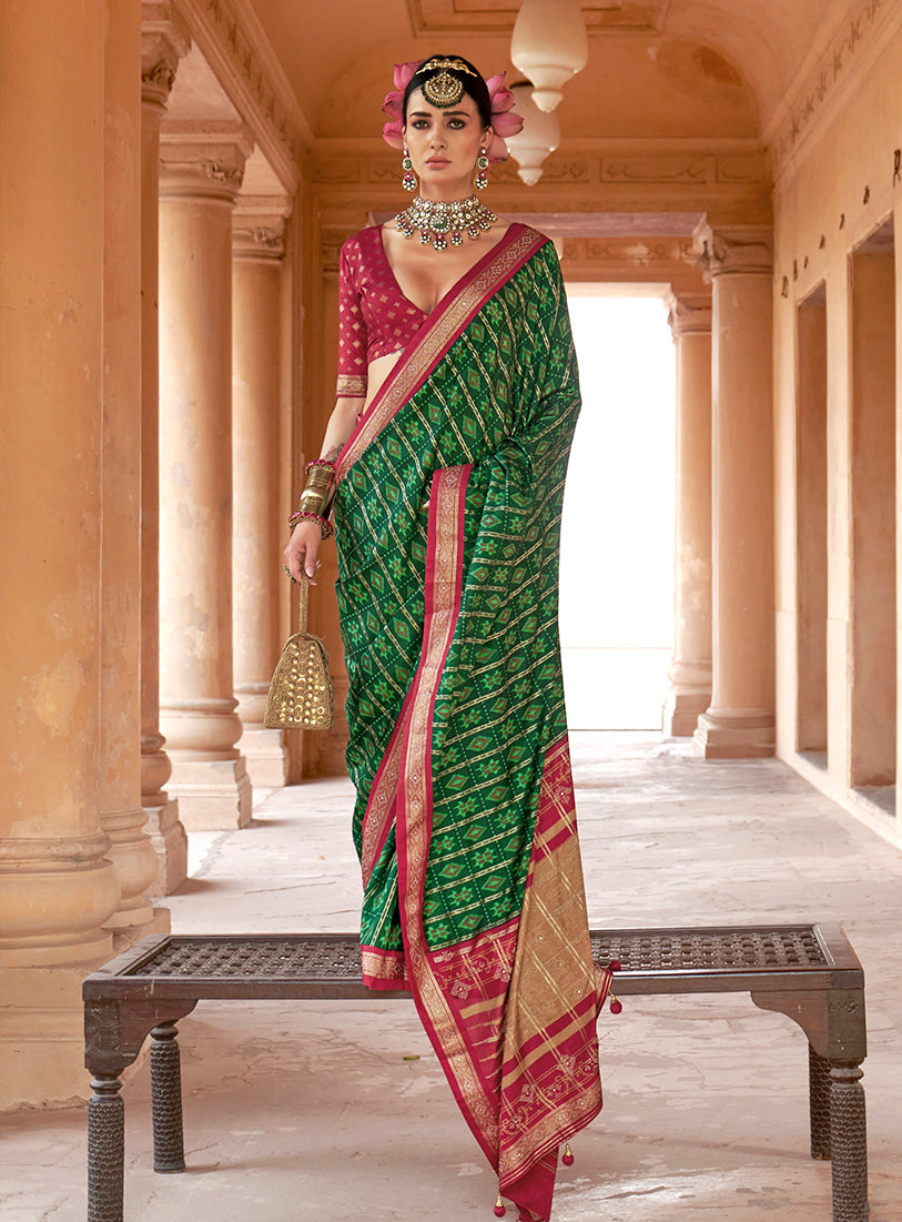 Elegant green silk blend saree featuring a traditional Patola print