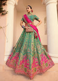Turquoise Banarasi silk lehenga choli set with intricate diamond wedding detailing