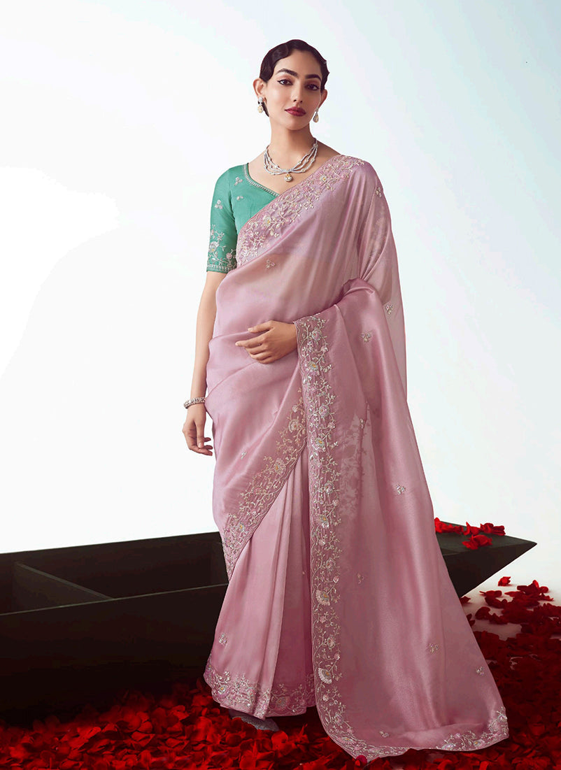 Light pink fancy fabric designer saree with delicate cut work embroidery