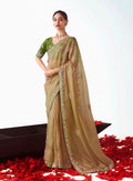 Beige fancy fabric designer saree with intricate embroidered cut work detailing.