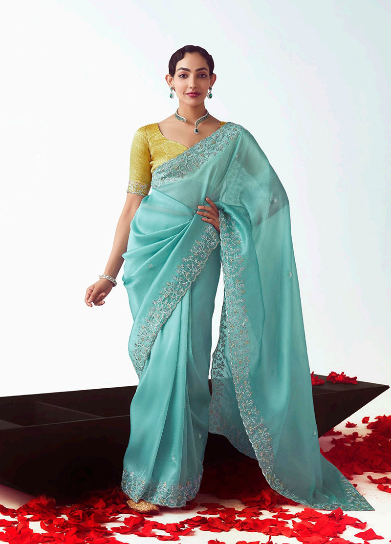 Aqua blue fancy fabric designer saree featuring intricate embroidered cut work.
