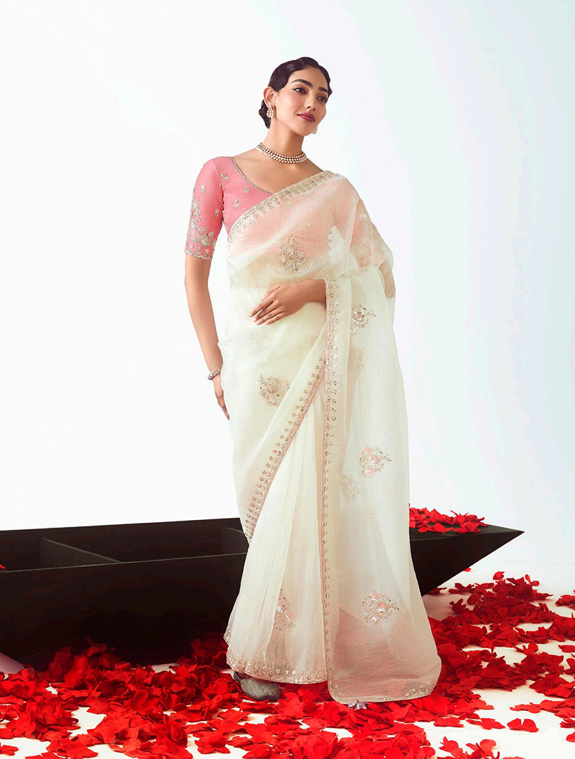 Pristine white designer saree with intricate cut-work embroidery