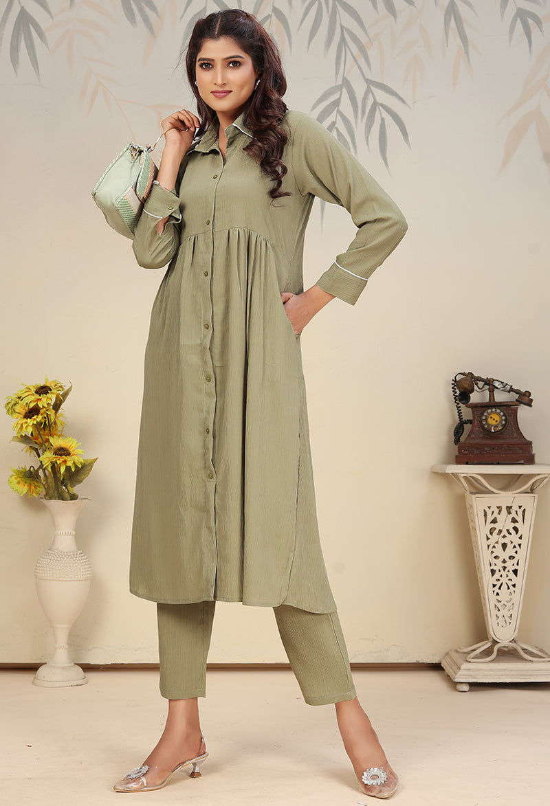 Woman wearing a Pista Green solid cotton co-ord set for casual or festival occasions