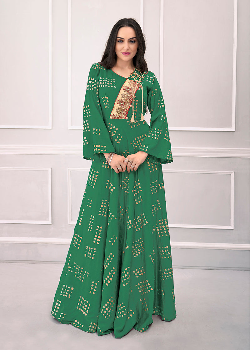 Close-up of a green muslin kurti featuring metallic foil print detail