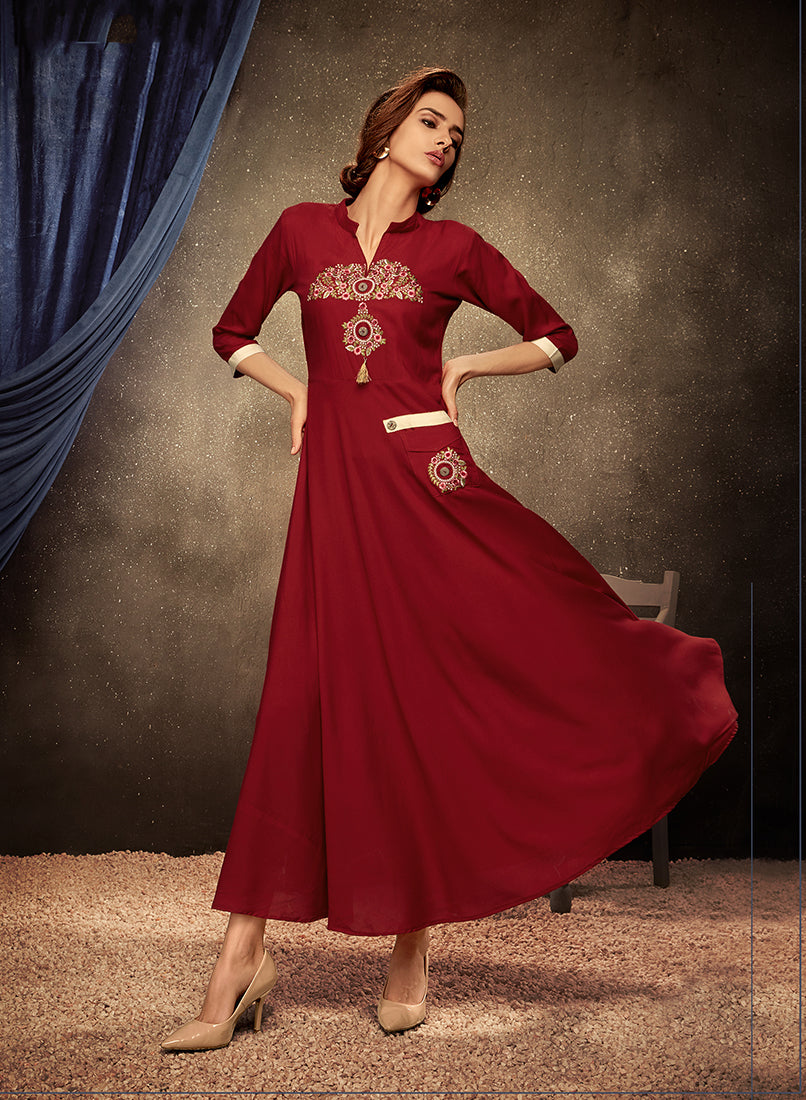 Sophisticated maroon rayon party wear kurti with detailed embroidery.