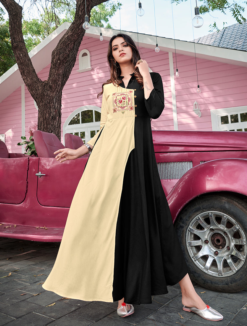 Woman wearing a cream and black rayon embroidered designer kurti