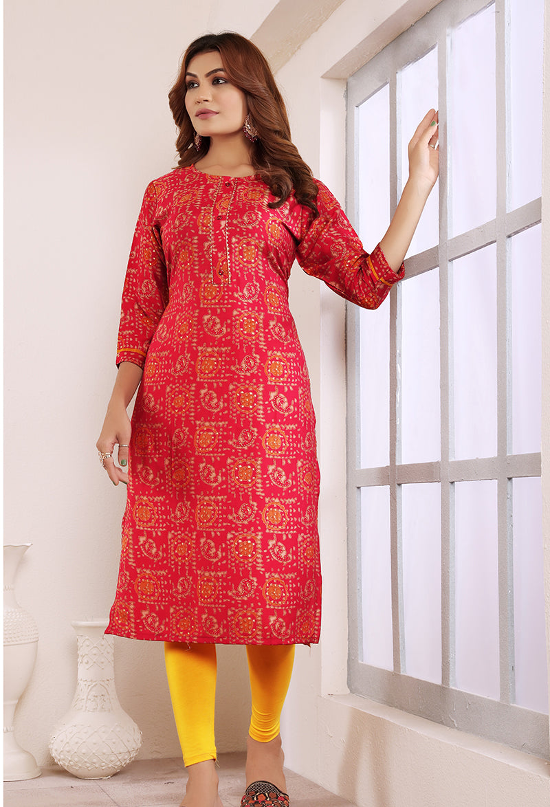 Rani pink viscose party wear kurti with button detailing and print accents.
