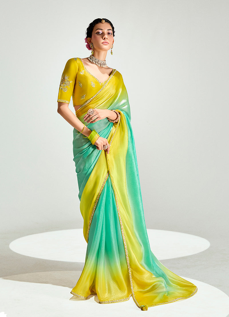 Yellow and Sea Green organza tissue saree with intricate sequins embroidery and tassel details