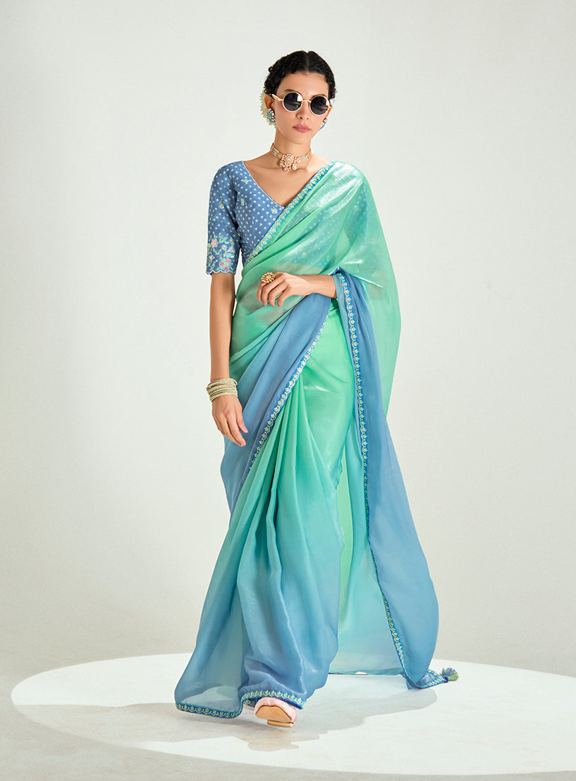 Sea Green and Light Blue Organza Tissue saree with sequins embroidery for engagement wear.