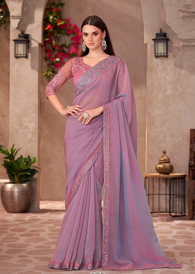 Elegant mauve pink georgette saree featuring a delicate golden embroidered lace border