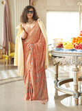 Peach georgette saree with elegant foil print work and classic styling.